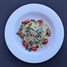 Caro Amico signature dishes LasagnaSpaghetti with Mizithra Cheese and Browned ButterPizza